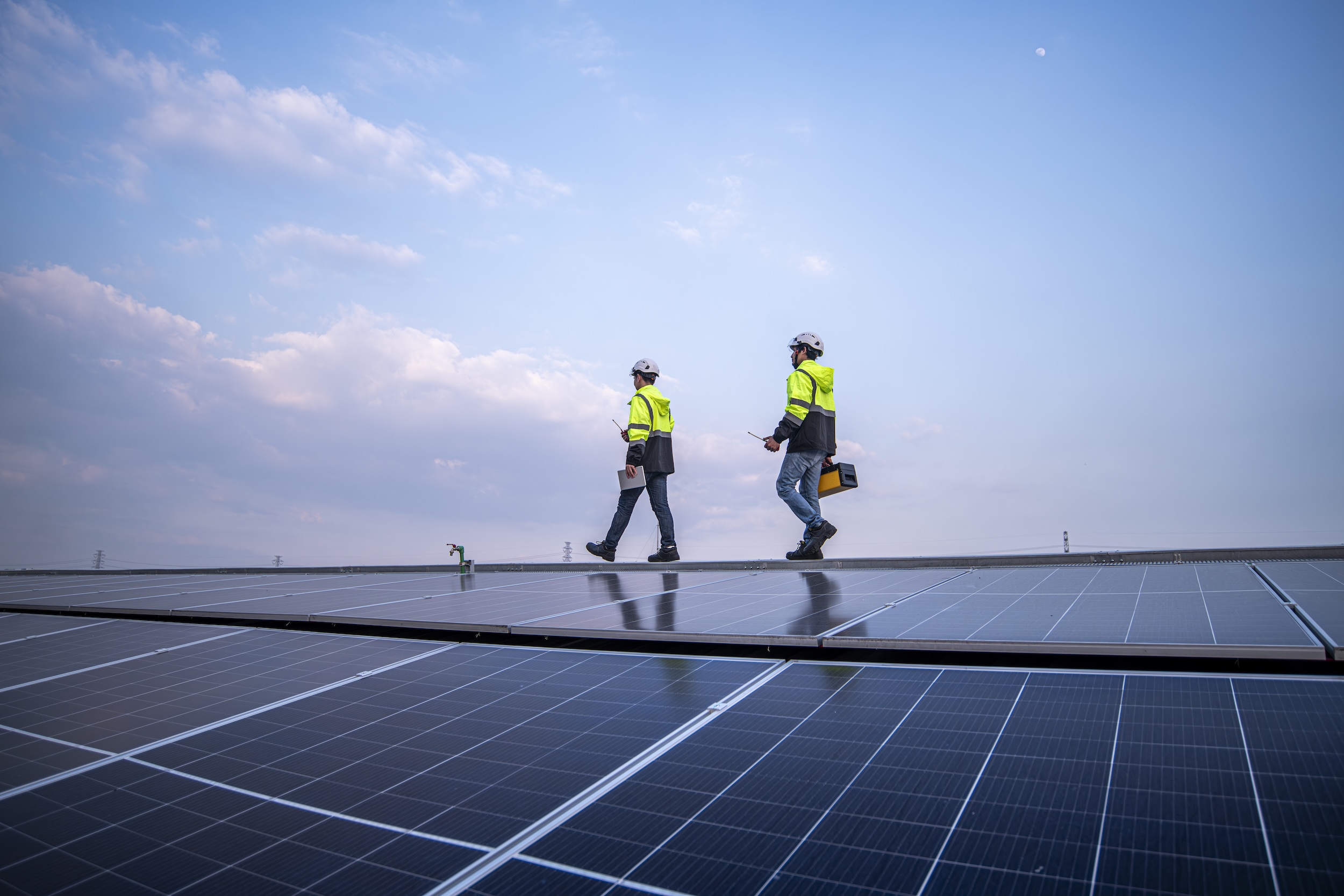 engineers-walking-on-factory-roof-inspect-survey-a-2025-03-15-22-02-19-utc