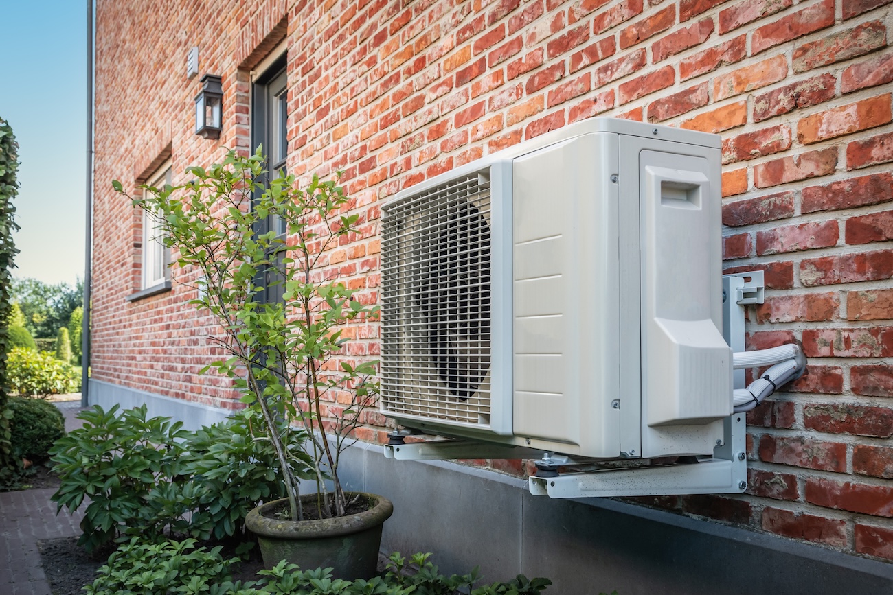 A view of a heat pump on the outside of a home, illustrating our guide to heat pumps in Ireland.