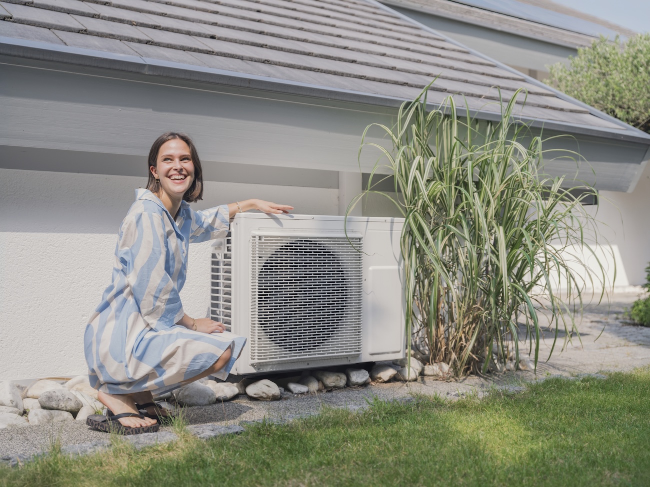 A woman examining what is a heat pump Ireland.