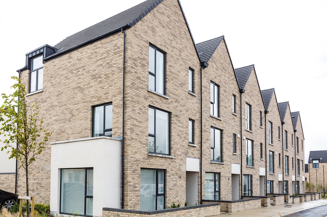 View of a row of semi-detached homes in a new NZEB Ireland housing development that meets NZEB requirements in Ireland.